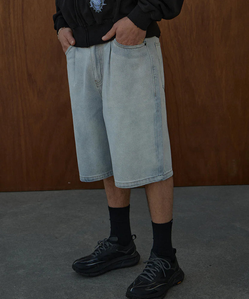 afends-fast-forward-denim-ultra-baggy-pleated-short-24-inch-stone-blue.webp