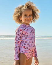 BILLABONG GIRLS 0-5 HULA HAZE ONE PIECE SHORTIE LONG SLEEVE RASH VEST – ORCHID