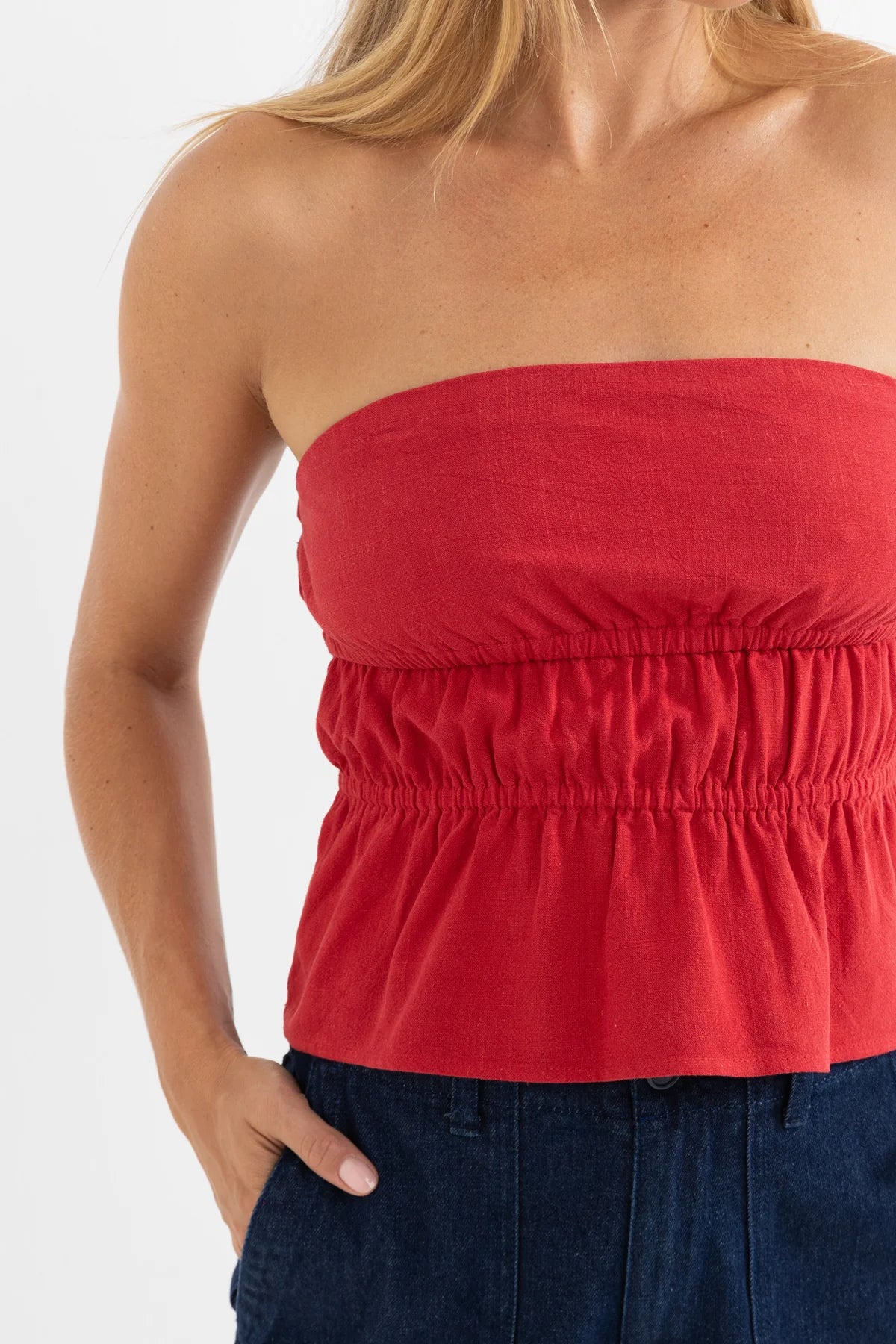 RHYTHM NADIA STRAPLESS TOP – SLIM FIT GATHERED PEPLUM STRAPLESS TOP – FIRE