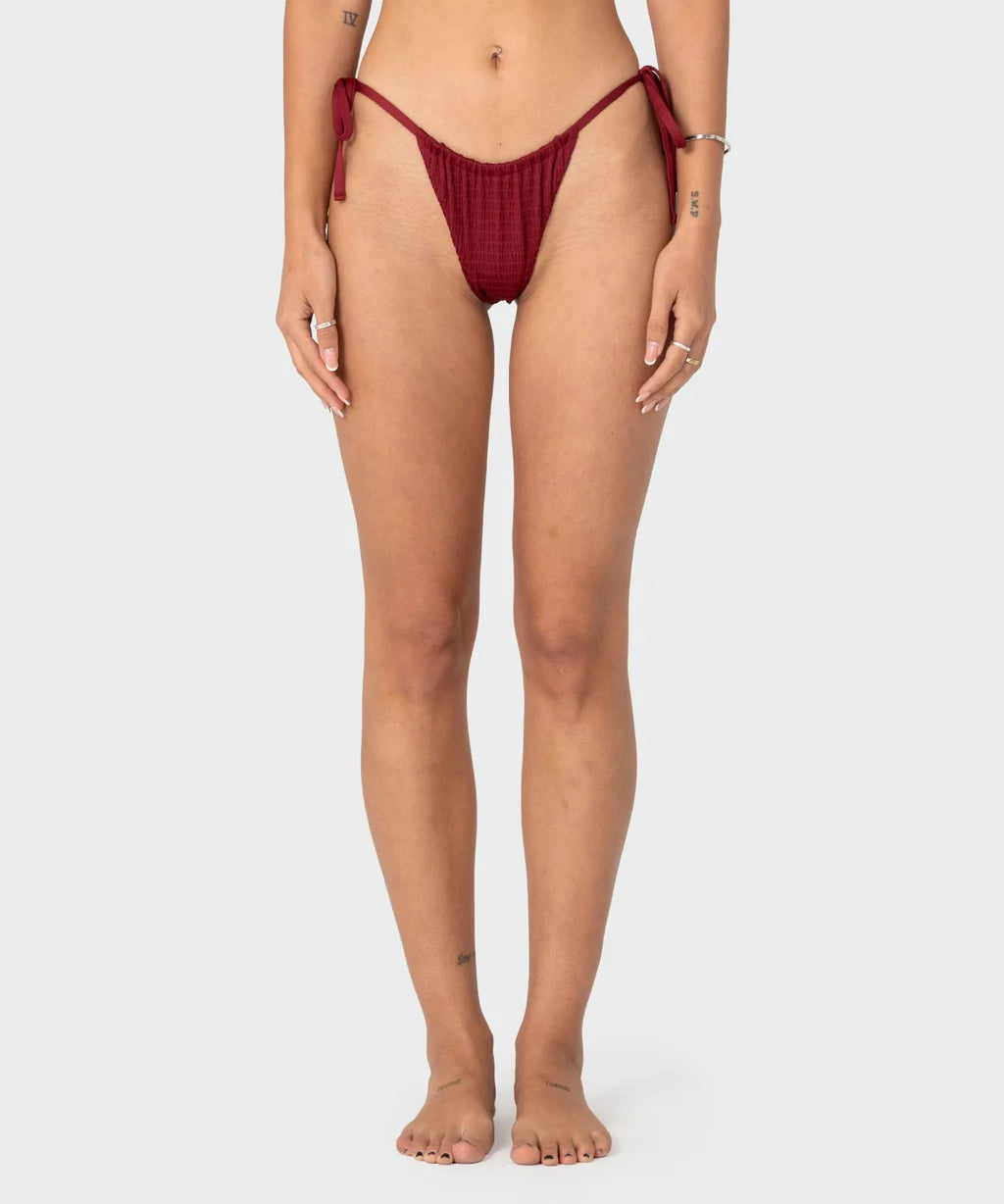 rusty-cedar-side-tie-cheeky-bikini-bottom-cranberry1.webp