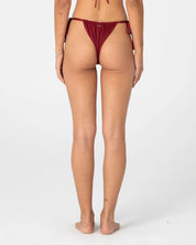 RUSTY CEDAR SIDE TIE CHEEKY BIKINI BOTTOM – CRANBERRY