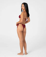 RUSTY CEDAR SIDE TIE CHEEKY BIKINI BOTTOM – CRANBERRY