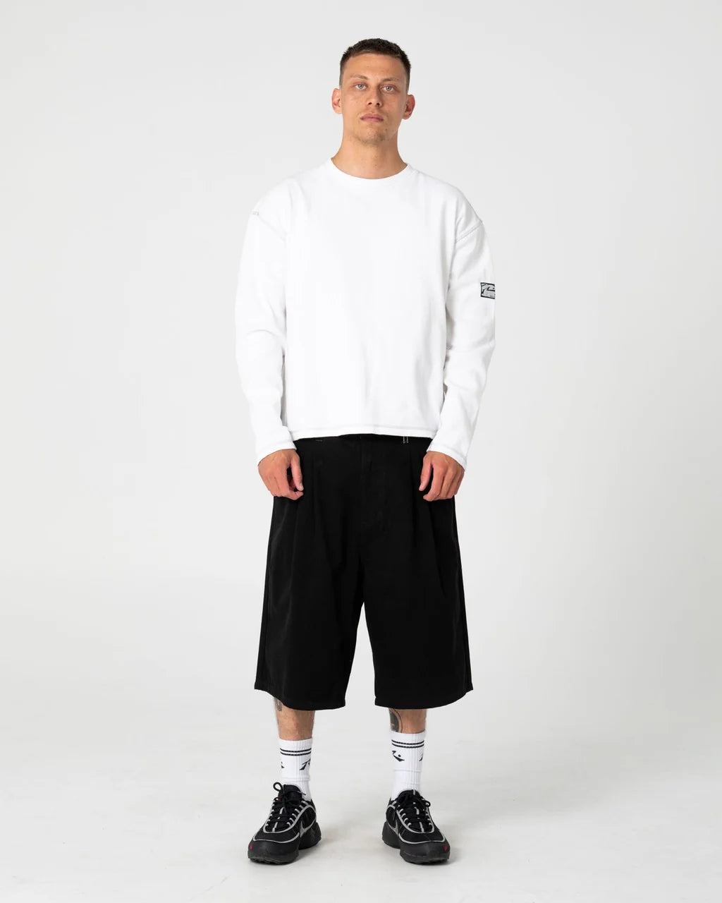 RUSTY ENIGMA PLEATED SHORT – BLACK