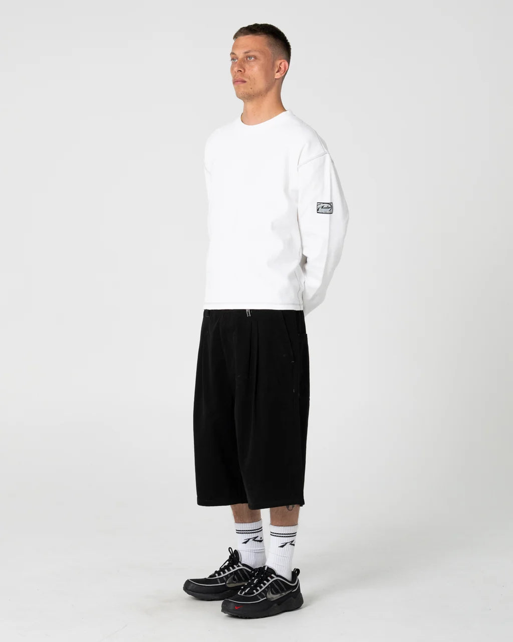RUSTY ENIGMA PLEATED SHORT – BLACK
