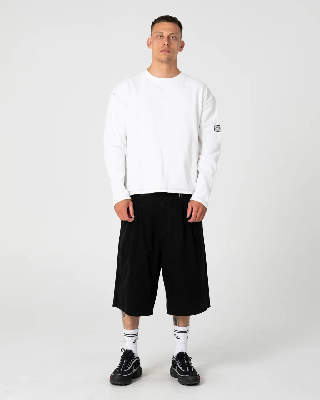 RUSTY ENIGMA PLEATED SHORT – BLACK