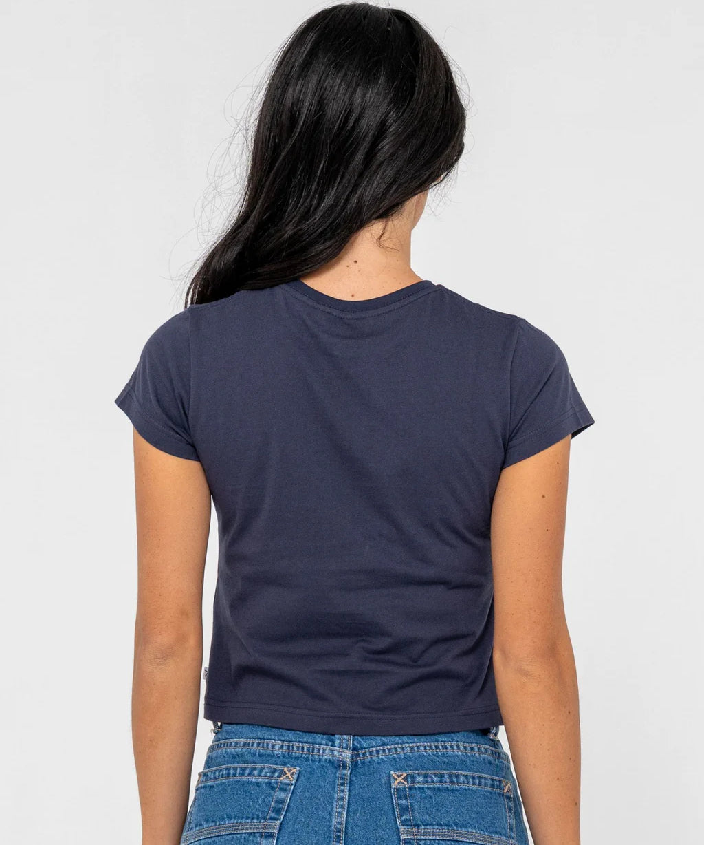 rusty-essentials-graphic-baby-tee-navy-blue-bodhi-surf-back.webp