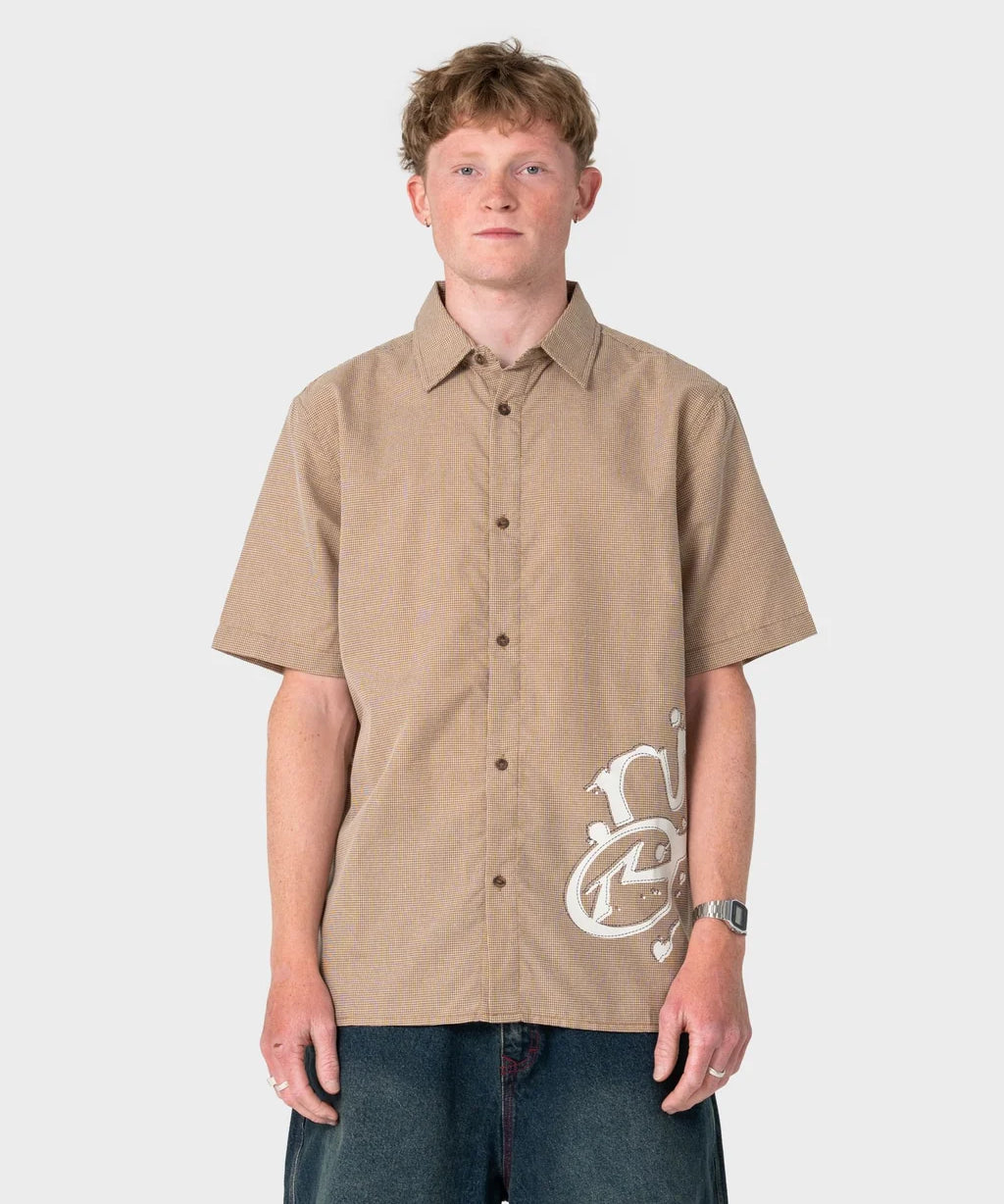 rusty-spray-n-pray-graphic-check-shirt-pinecone1.webp