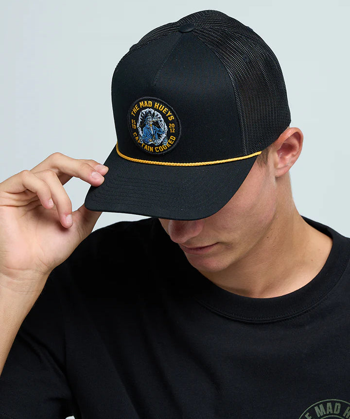 the-mad-hueys-captain-cooked-jaws-mens-trucker-cap-black-bodhi-surf1.webp